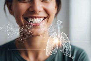 a person smiling, with a subtle overlay showing connections between teeth and lungs, symbolizing the link between oral health and respiratory health.