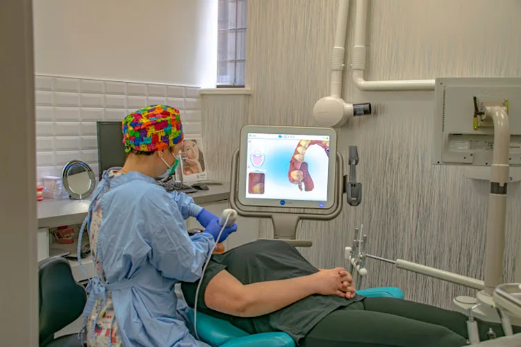 Dentist in West End Vancouver providing dental care to a patient at O2 Dental